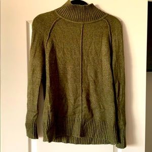 Green turtleneck sweater